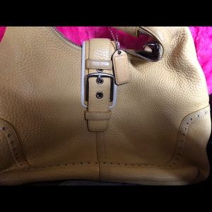 Yellow authentic coach purse.